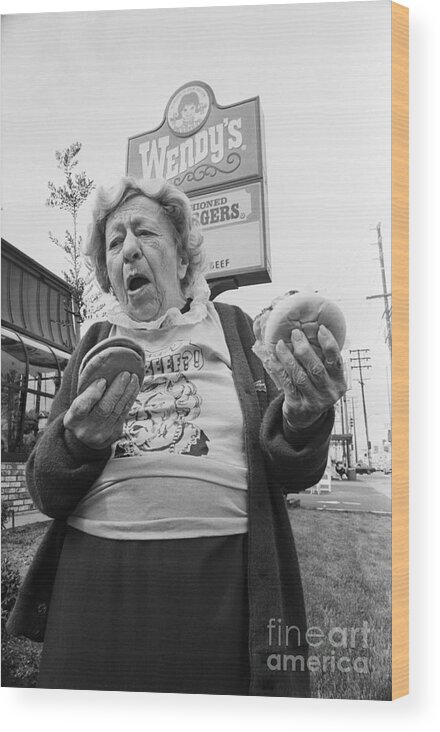1980-1989 Wood Print featuring the photograph Clara Peller Outside A Wendys Restaurant by Bettmann