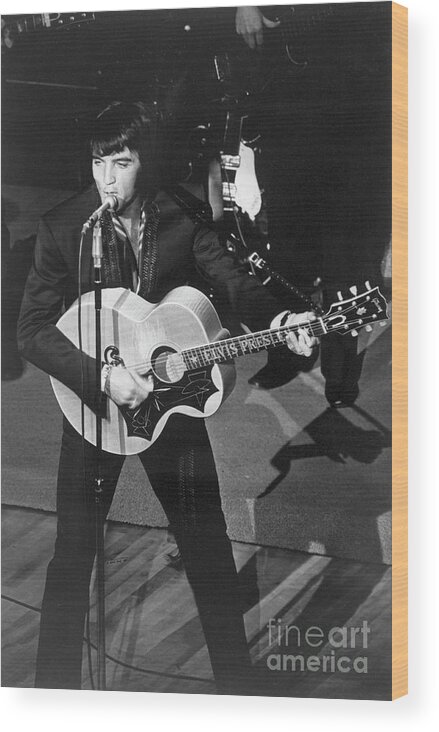 Rock Music Wood Print featuring the photograph Elvis Presley Playing Guitar And Singing by Bettmann