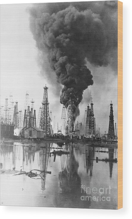 Finance And Economy Wood Print featuring the photograph Fire Burning @ Oil Well Flames, Smoke by Bettmann