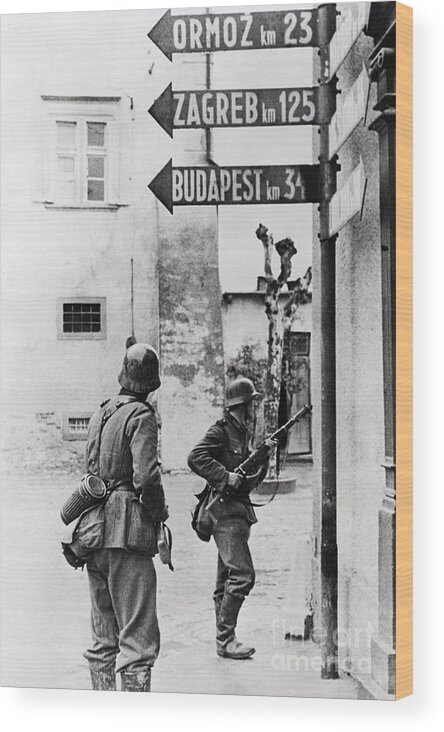 Releasing Wood Print featuring the photograph German Infantry In Yugoslav Town by Bettmann