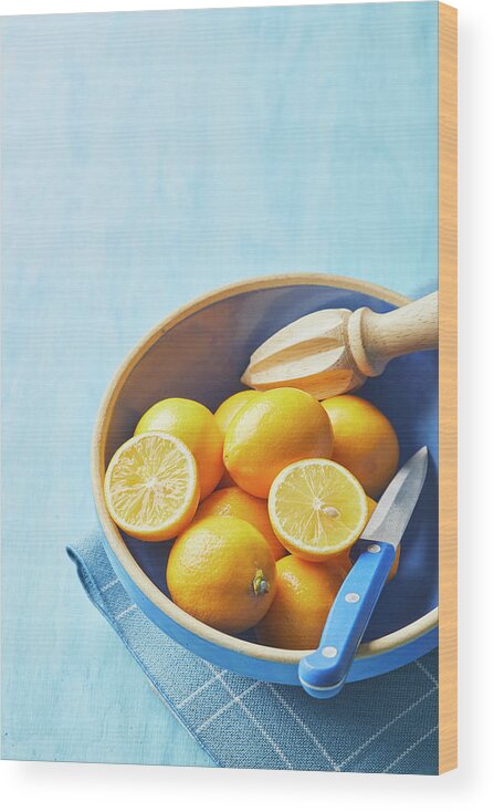 Lemons Wood Print featuring the photograph Lemons in a blue bowl by Cuisine at Home