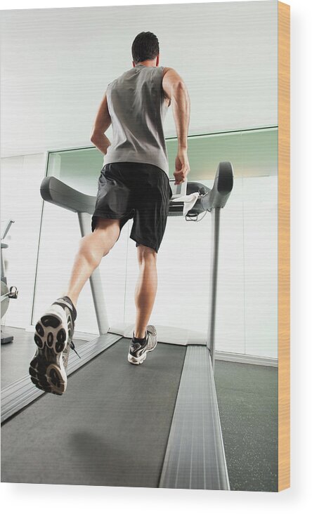 People Wood Print featuring the photograph Mixed Race Man Running On Treadmill by Erik Isakson