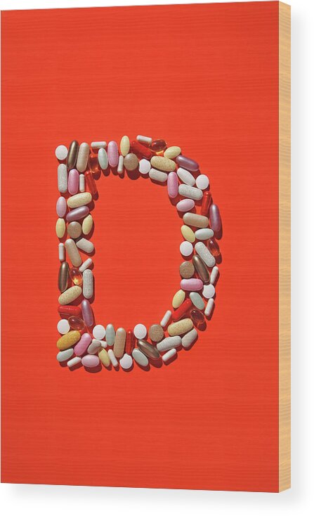 Vitamin Wood Print featuring the photograph Multi-vitamin Pills And Capsules by Nicholas Eveleigh