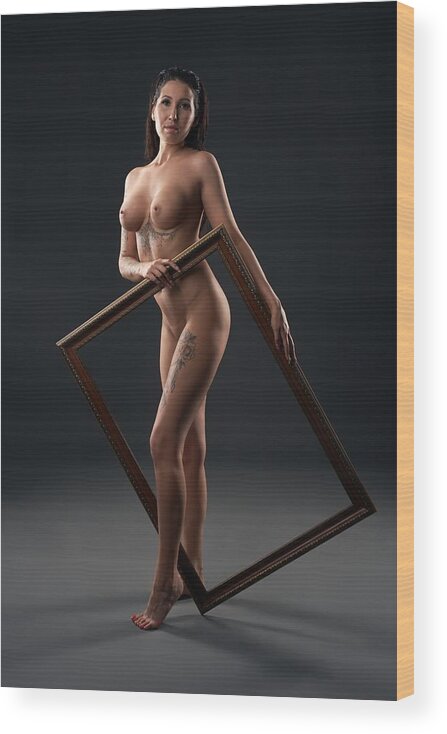 Woman; Wood Print featuring the photograph Nude Female Model Looking At Camera While Holding Large Picture Frame by Andrey Guryanov