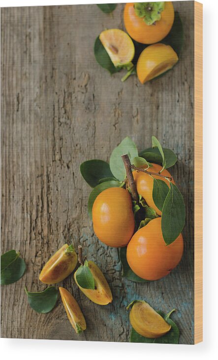Orange Color Wood Print featuring the photograph Persimmons by Tania Mattiello