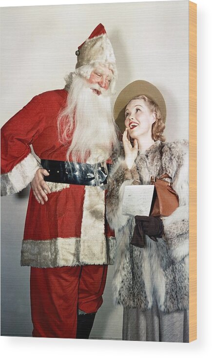Santa Claus Wood Print featuring the photograph Santas List by Michael Ochs Archives