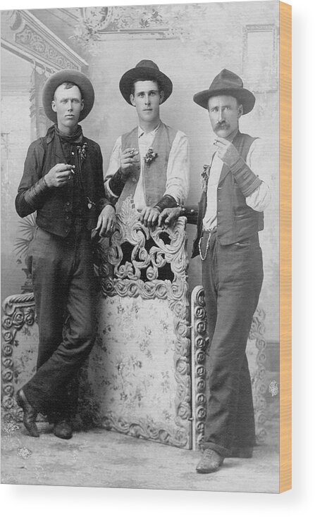 People Wood Print featuring the photograph Vintage Image Of Cowboys Drinking And by Thinkstock Images