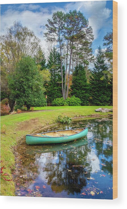 Boats Wood Print featuring the photograph Canoe on the Edge of the Lake #1 by Debra and Dave Vanderlaan