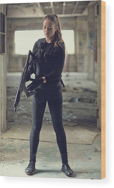 Expertise Wood Print featuring the photograph Female military swat team member holding rifle in abandoned warehouse #3 by Lorado