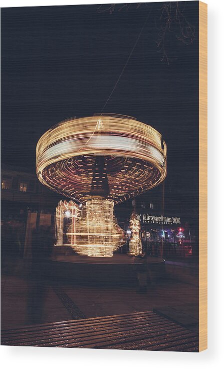 Illuminations Wood Print featuring the photograph Christmas carousel on the streets of Warsaw. Fire Wheel by Vaclav Sonnek