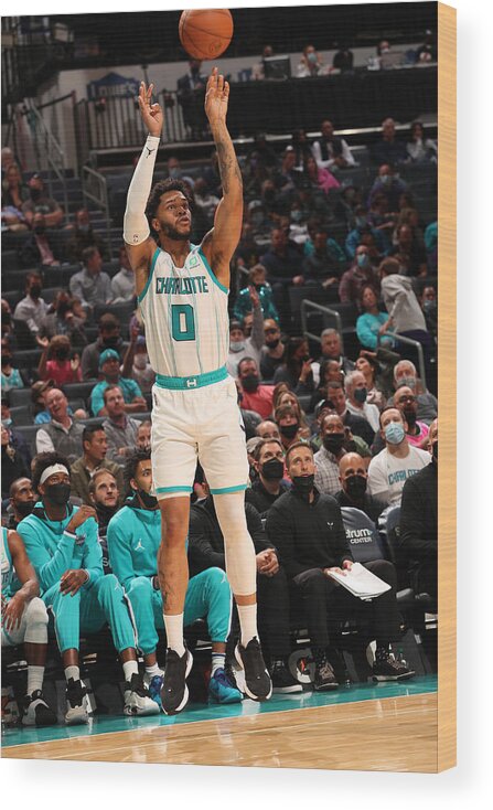 Miles Bridges Wood Print featuring the photograph Cleveland Cavaliers v Charlotte Hornets by Kent Smith