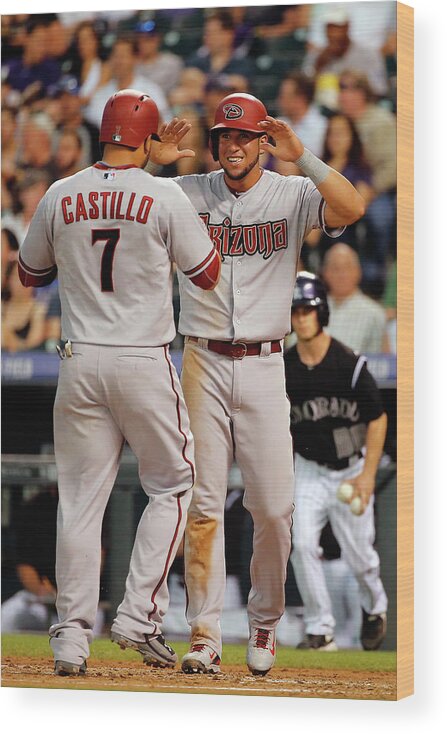 Second Inning Wood Print featuring the photograph David Peralta, Welington Castillo, and Kyle Kendrick by Doug Pensinger