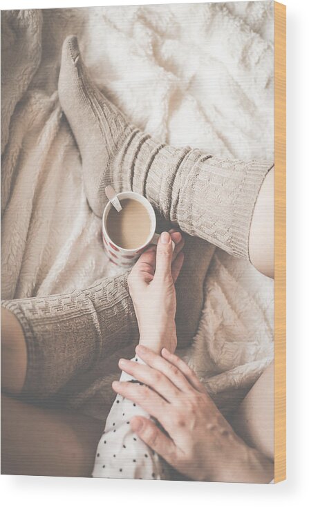 People Wood Print featuring the photograph Female legs in knitted socks with cup of coffee by MilosStankovic