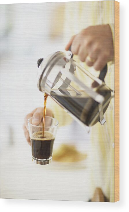 Breakfast Wood Print featuring the photograph Man pouring coffee from cafetiere in to mug, close-up, mid section by Maren Caruso