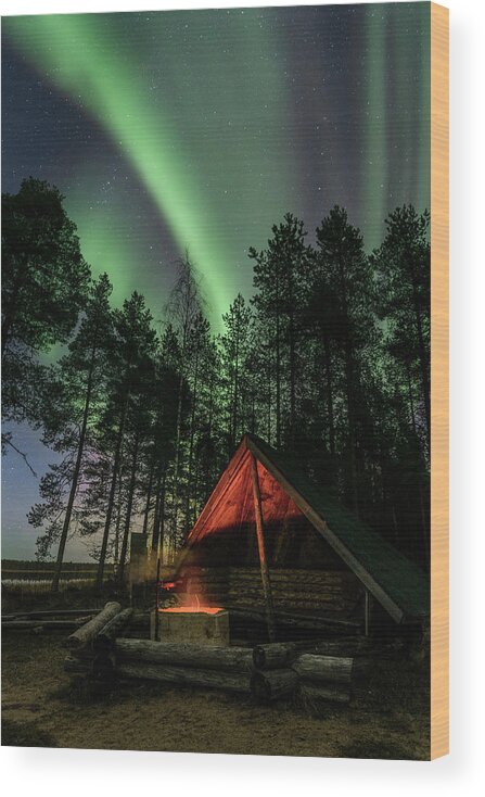 Aurora Borealis Wood Print featuring the photograph Northern lights above a fire place by Thomas Kast