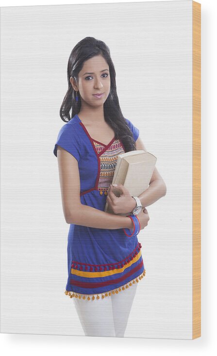 Three Quarter Length Wood Print featuring the photograph Portrait of college girl with book by IndiaPix/IndiaPicture