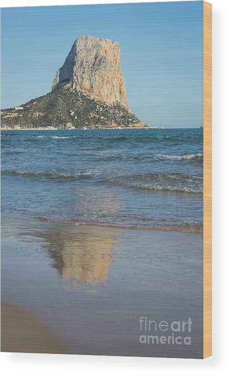 Sandy Beach Wood Print featuring the photograph Sandy beach in Calpe and the Penon de Ifach by Adriana Mueller