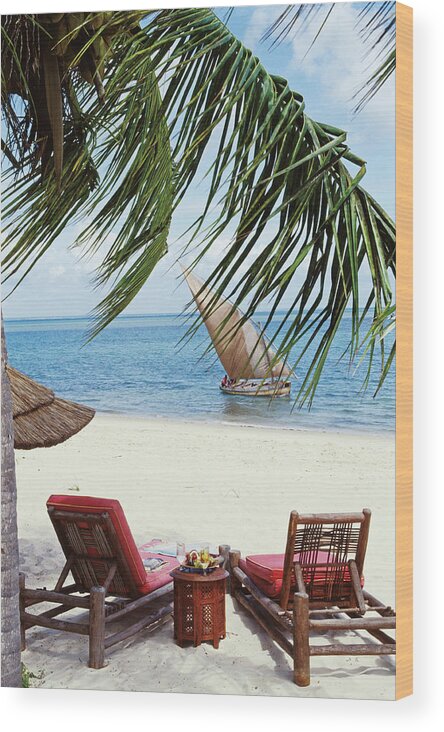 Traveloutdoorsbeachseasandpalm Tree Tropicalislandrelaxationboatfishingsummerskyoceanvacationsailboat Wood Print featuring the photograph View of a Secluded Beach in Mozambique by Tim Beddow