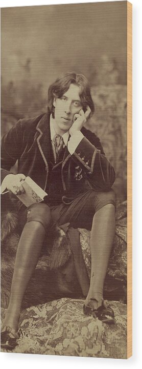 Oscar; Wilde; Irish; Writer; Poet; Author; Dandy; Photograph; Sepia; Black; White; Velvet; Smoking; Jacket; Breeches; Wearing; Stockings; Full; Length; Seated; Oscar Wilde Wood Print featuring the photograph Oscar Wilde 1882 by Napoleon Sarony