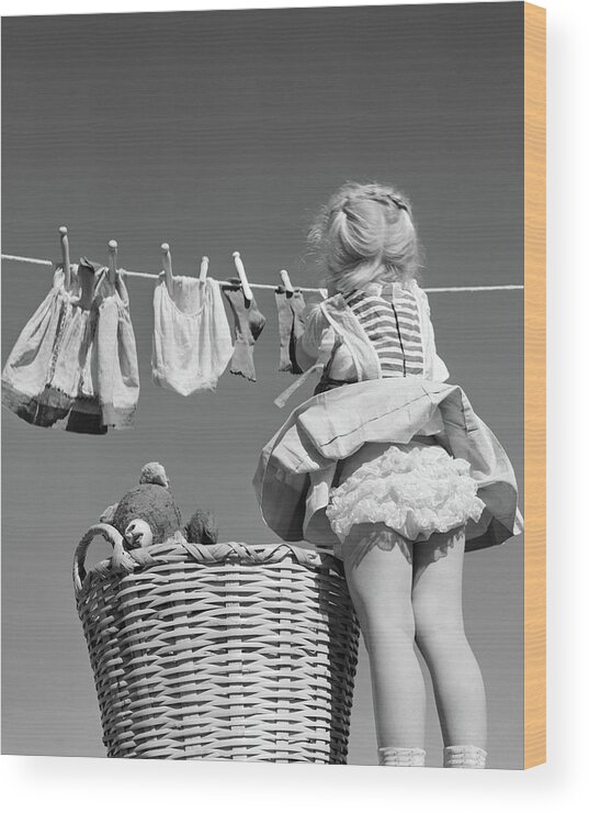 1950s Back View Of Girl Hanging Laundry Wood Print by Vintage Images - Fine  Art America
