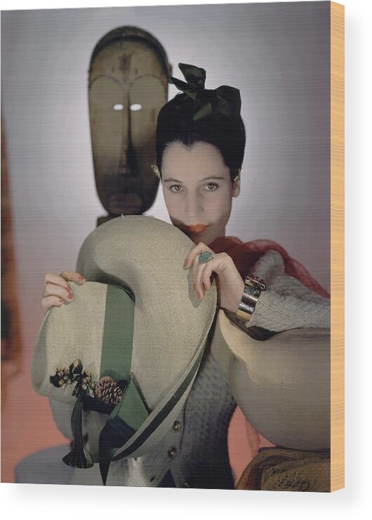 Accessories Wood Print featuring the photograph A Model Holding A Sun Hat by Horst P. Horst