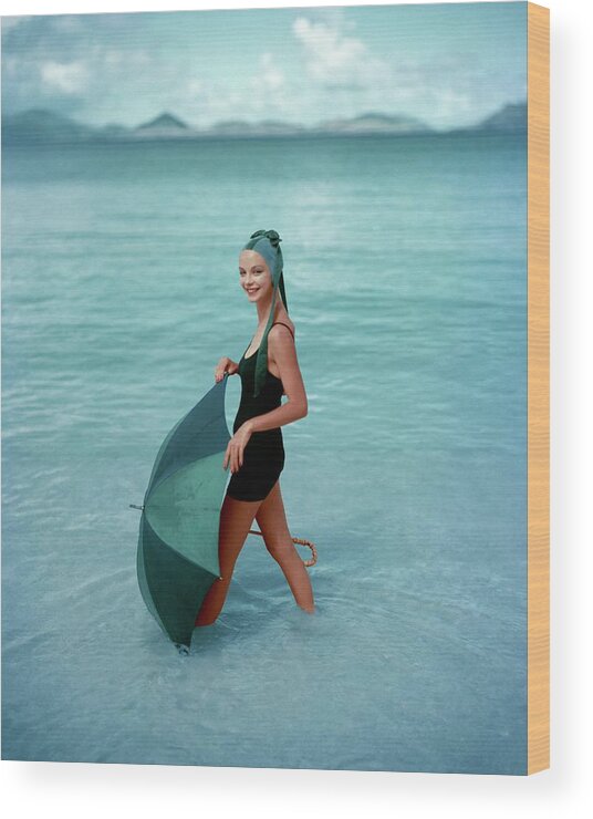 Fashion Wood Print featuring the photograph A Model In The Sea With An Umbrella by Richard Rutledge