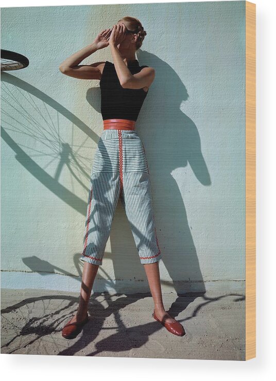 Fashion Wood Print featuring the photograph A Model Wearing A Turtleneck And Capri Pants by Serge Balkin
