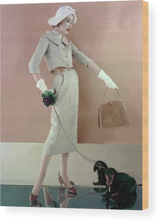 Fashion Wood Print featuring the photograph A Model Wearing A Tweed Jacket And Skirt by Karen Radkai