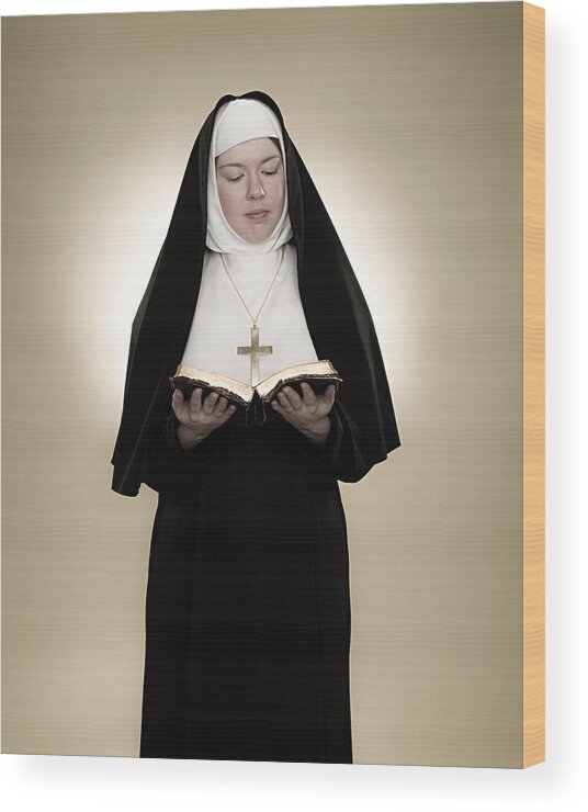 People Wood Print featuring the photograph A nun reading a bible by Image Source