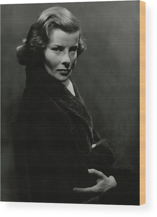 Studio Shot Wood Print featuring the photograph A Portrait Of Katharine Hepburn With Her Arms by Lusha Nelson