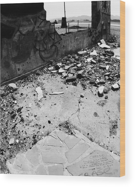 Left Behind In The Rubble Wood Print featuring the photograph Left Behind in the Rubble -- Motorcyclist and Graffiti in Amboy, California by Darin Volpe