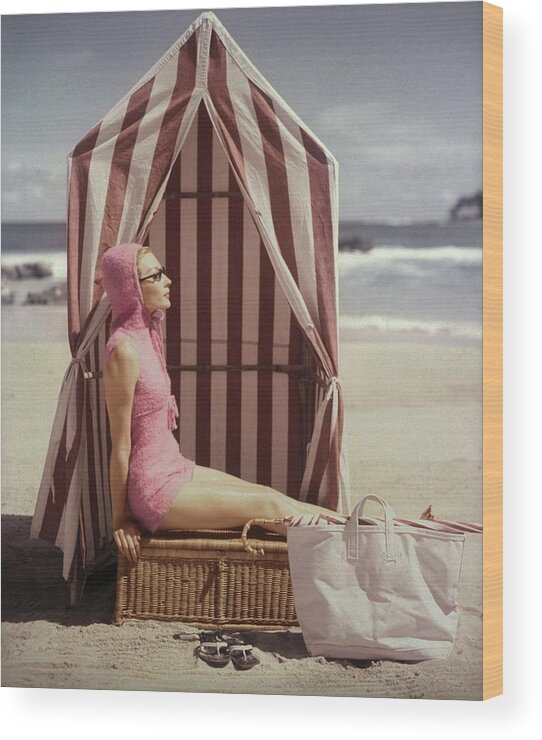 Fashion Wood Print featuring the photograph Model In Pink Swimsuit With Tent On Beach by Louise Dahl-Wolfe