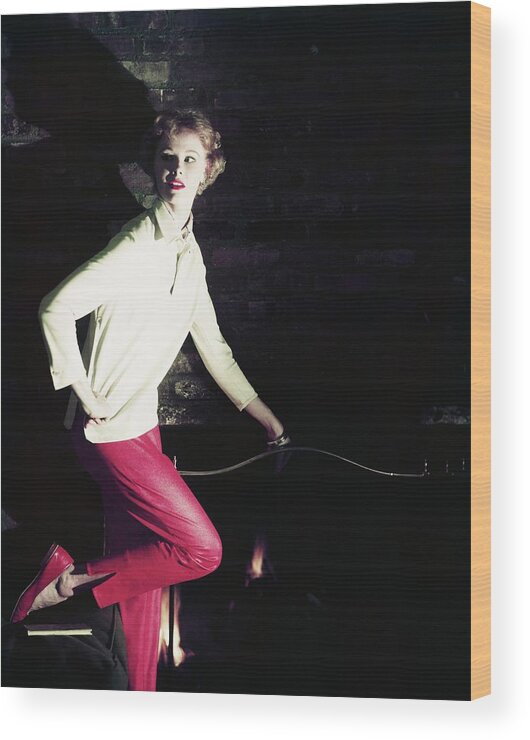 Indoors Wood Print featuring the photograph Model Wearing Sweater And Pants by Horst P. Horst