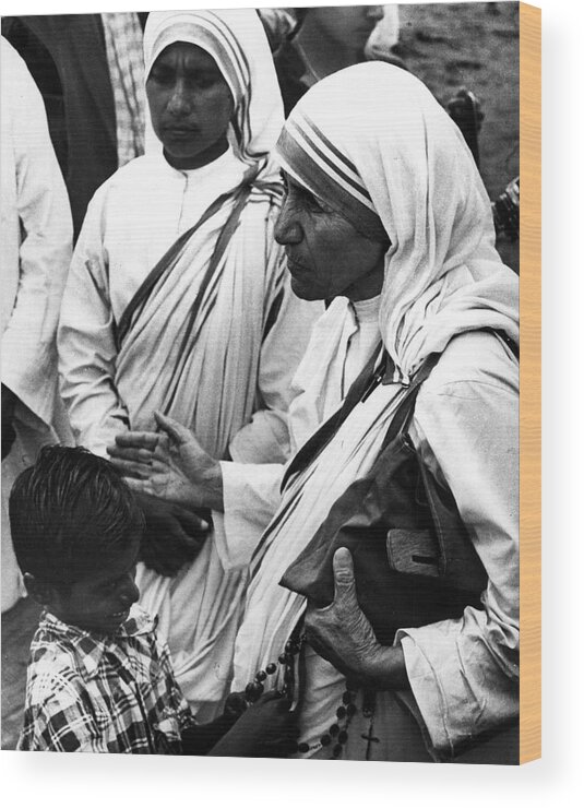 Classic Wood Print featuring the photograph Mother Teresa With Young Boy by Retro Images Archive