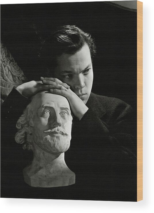 Artist Wood Print featuring the photograph Orson Welles Resting On A Sculpture by Cecil Beaton