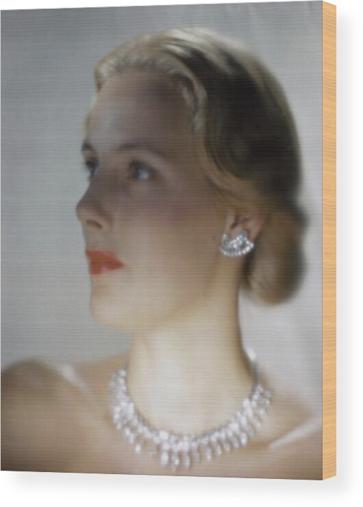 Accessories Wood Print featuring the photograph Out Of Focus Image Of A Model Wearing A Diamond by Erwin Blumenfeld