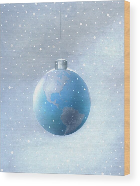 Anticipation Wood Print featuring the photograph Snow Falling Around Hanging Globe by Ikon Ikon Images