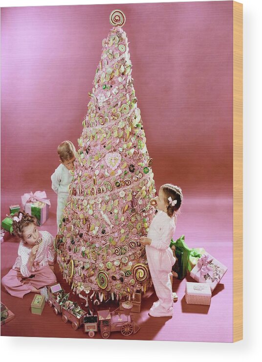 Three People Wood Print featuring the photograph Three Children Eating A Candy Christmas Tree by Herbert Matter