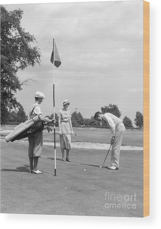1930s Wood Print featuring the photograph Couple Playing Golf, C.1930s by H. Armstrong Roberts/ClassicStock