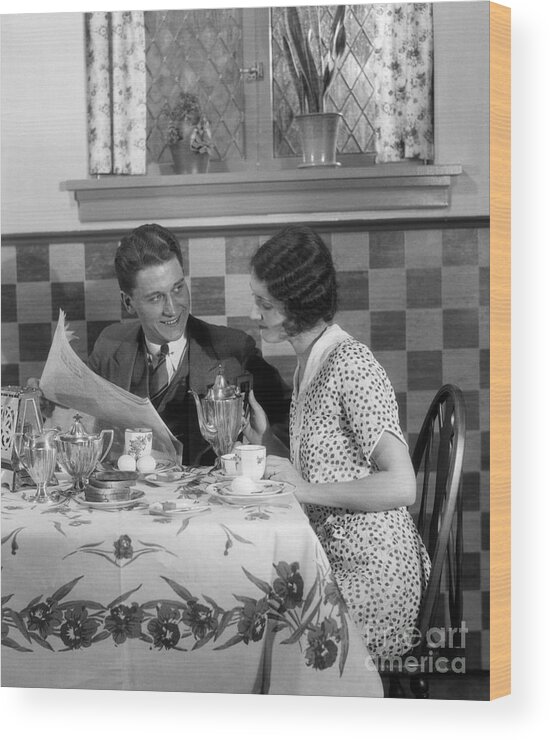 1930s Wood Print featuring the photograph Couple Reading Paper At Breakfast by H. Armstrong Roberts/ClassicStock