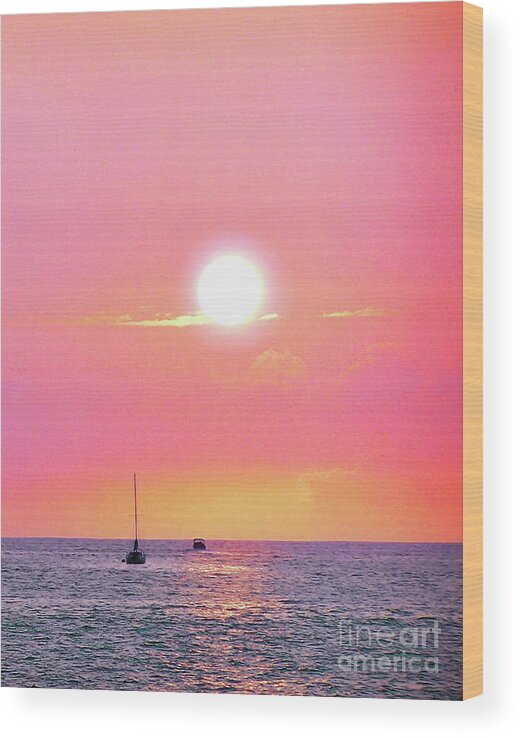 Black Boats In Silhouette Await The Final Moments As This Hot Hawaiian Sun Sinks Into The Delicious Blue Blue Sea..a Saturated Pink Sky And Wisps Of Yellow And Orange Clouds Linger Underneath. Wood Print featuring the photograph White hot sun bright pink Hawaiian seaside sky by Priscilla Batzell Expressionist Art Studio Gallery