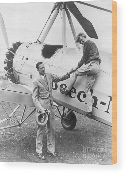 Following Wood Print featuring the photograph Amelia Earhart And Her Husband by Bettmann