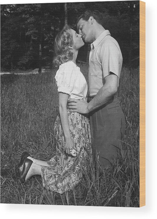 Heterosexual Couple Wood Print featuring the photograph Couple Kissing Outdoors by George Marks