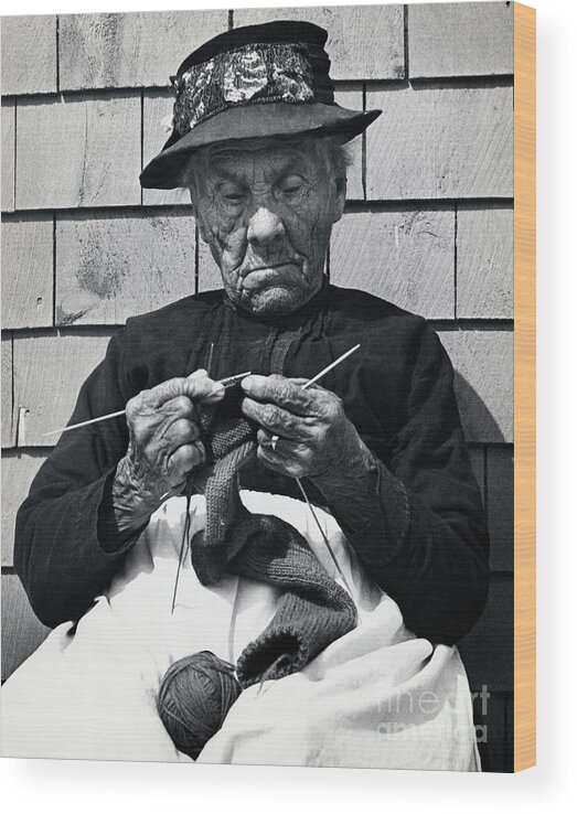 People Wood Print featuring the photograph Elderly Woman Seated Knitting by Bettmann