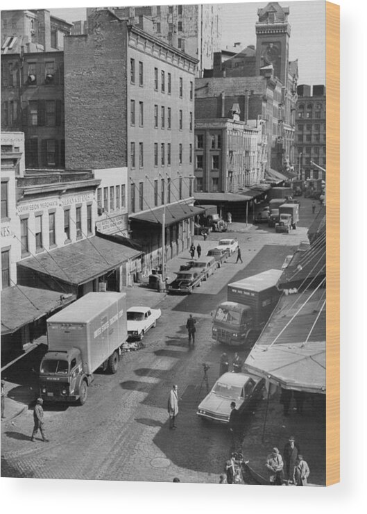 General View Wood Print featuring the photograph General View Of Moving Vans Loading Up by New York Daily News Archive