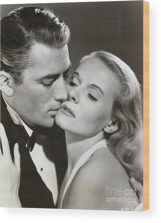 People Wood Print featuring the photograph Gregory Peck Kissing Ann Todd by Bettmann