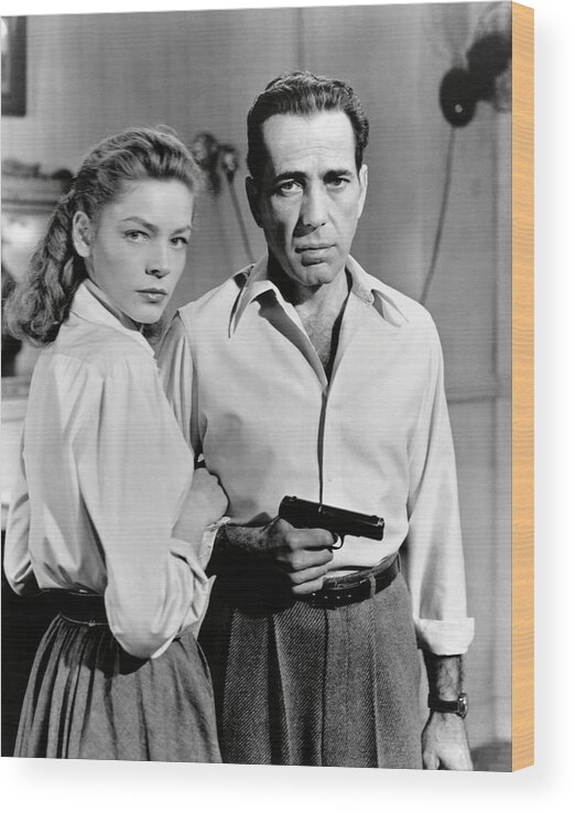 Humphrey Bogart Wood Print featuring the photograph LAUREN BACALL and HUMPHREY BOGART in KEY LARGO -1948-. by Album