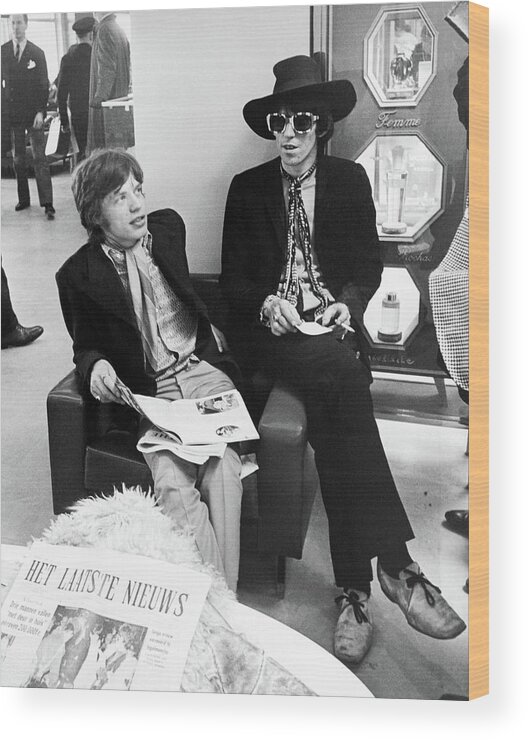 1960s Wood Print featuring the photograph Mick Jagger And Keith Richards Candid With Newspaper by Globe Photos