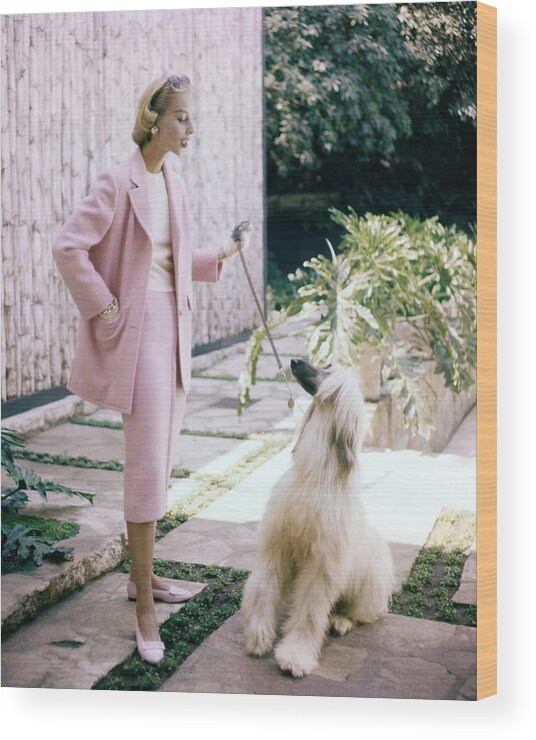 #new2022vogue Wood Print featuring the photograph Model With An Afghan Hound by Clifford Coffin
