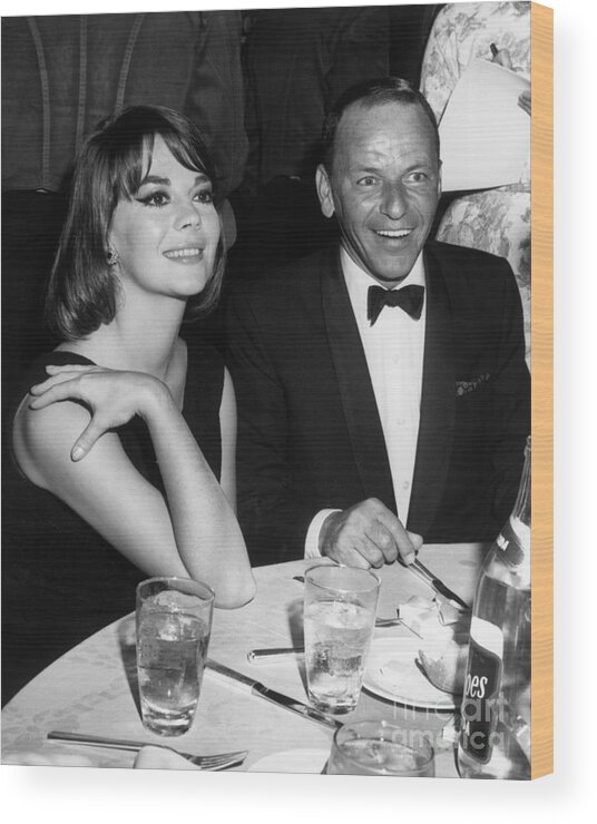 My Fair Lady Wood Print featuring the photograph Natalie Wood And Frank Sinatra Dining by Bettmann